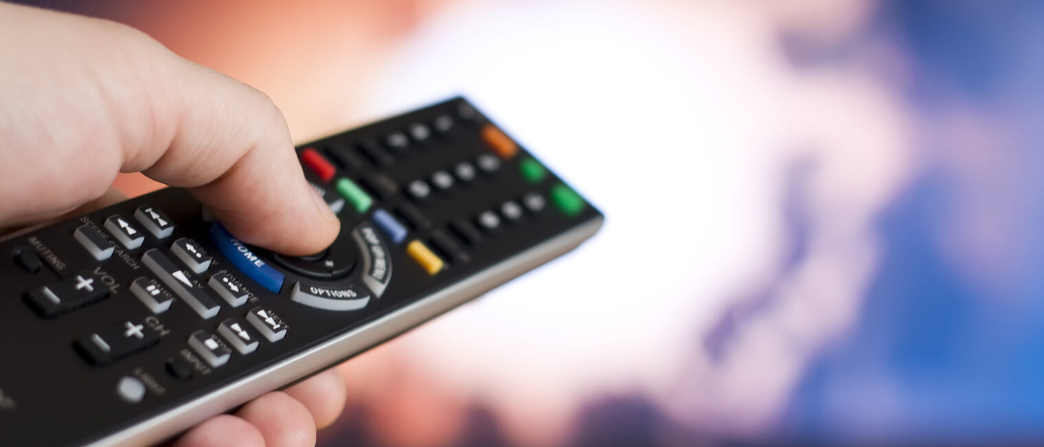 remote, remote control, channel, channel surfing, hand, tv, television, media, movies, movie, film, entertainment, fingers, holding, changing channel, watching tv, watching television, relaxation, buttons, selective focus, copy space