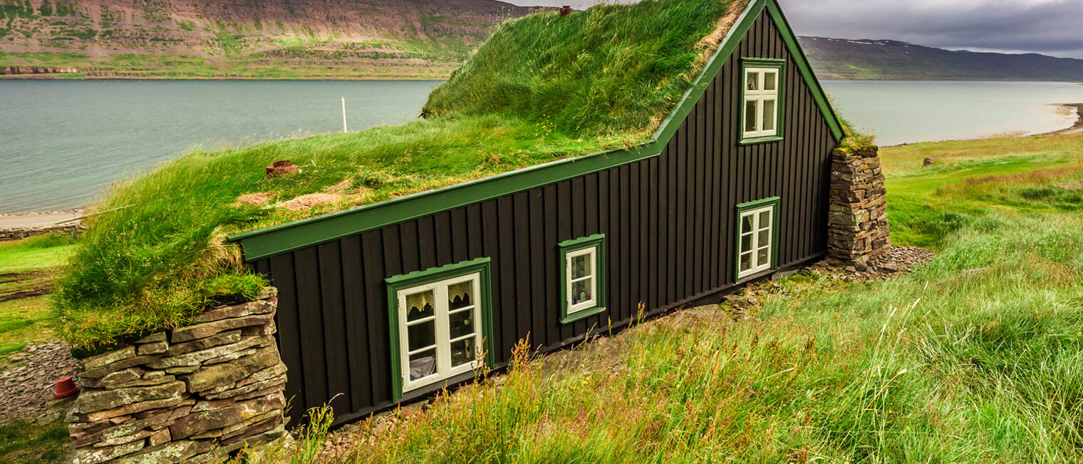 Cottage covered with grass on the roof in Iceland Schlagwort(e): iceland, house, grass, roof, small, green, light, traditional, wooden, icelandic, natural, nature, europe, mountain, window, museum, home, rural, old, landscape, outdoors, building, countryside, north, little