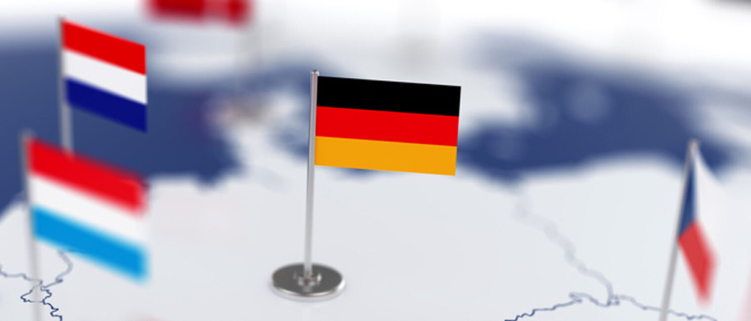 Germany flag in the focus. Europe map with countries flags. Shallow depth of field 3d illustration rendering isolated on white background Schlagwort(e): Germany, flag, european, map, white, world, union, international, concept, atlas, travel, business, symbol, politics, european union, sign, emblem, conceptual, group, political, dof, depth of field, soft focus, shallow depth of field, rendering, continent, illustration, cartography, design, eu, country, countries, geography, land, isolated, economy, national, earth, location, united, nation, blue, global, border, icon, outline, set, globe, europe, 3d