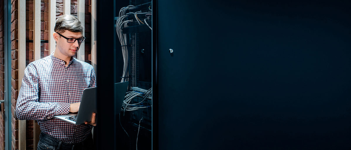 In the server room a technician/ It engineer/ with glasses hold the notebook and adjust the internet connecting or fix the server error. Schlagwort(e): fix, hand, man, notebook, technician, database, receiver, wifi, wireless, system, pc, traffic, optical, cabling, link, job, networking, storage, plug, fiber, datacenter, router, lan, switch, industry, tech, web, engineer, professional, work, equipment, digital, security, room, computer, rack, service, it, hardware, connection, information, technology, cable, server, network, data, internet, center, glasses