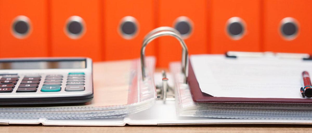 calculator and document on top of open folder with documentation in background, accounting concept Schlagwort(e): accountant, accounting, advisor, archive, binder, bookkeeper, bookkeeping, books, business, calculator, company, concept, desk, document, documentation, dossier, file, finance, firm, folder, holder, invoice, law, legal, manual, many, open, orange, organization, organize, organized, paperwork, pay, pile, record, red, regulation, regulator, standard, store, table, taxes, stacked, stack, closeup