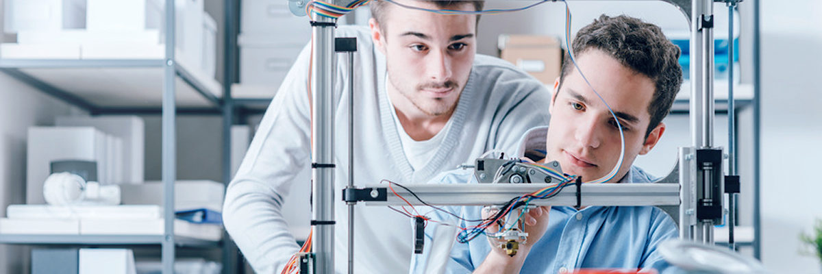 Young students researchers using an innovative 3D printer in the laboratory, engineering and prototyping concept Schlagwort(e): 3D, 3D Print, 3D Printer, 3D Printing, Academic, College, Components, Creative, Creativity, Design, Education, Electrical, Electronic, Engineer, Engineering, Industry, Innovation, Invention, Lab, Laboratory, Learning, Manufacturing, Material, Mechanical engineer, Men, Precision, Product, Project, Prototyping, Research, School, Science, Scientist, Student, Studying, Tech, Technician, Technology, Test, Testing, Tool, Two people, University, Wires, Working, Young