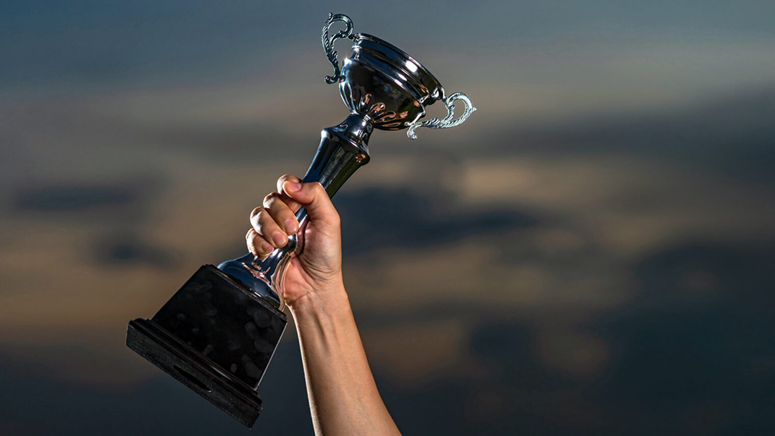 a man holding up a trophy cup on against cloudy twilight sky background, The winner and successful concept Schlagwort(e): trust, first place, trophycup, teamwork, trophy cup, photography, cloudscape, achieve, championship, 1st, background, leader, concept, metal, golden, gold, best, successful, reward, event, achievement, competition, award, trophy, victory, celebration, success, cup, business, ceremony, sport, hand, first, motivation, holding, men, place, up, inspiration, sky, winning, athlete, ideas, blue, human, prize, leadership, win, winner, champion, trust, first place, trophycup, teamwork, trophy cup, photography, cloudscape, achieve, championship, 1st, background, leader, concept, metal, golden, gold, best, successful, reward, event, achievement, competition, award, trophy, victory, celebration, success, cup, business, ceremony, sport, hand, first, motivation, holding, men, place, up, inspiration, sky, winning, athlete, ideas, blue, human, prize, leadership, win, winner, champion