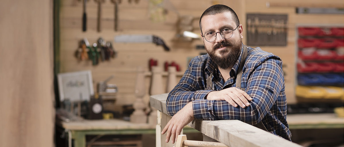 furniture designer, carpenter, small business, owner, young adult, mature men, working, craft, business, craftsperson, manual worker, intelligence, smiling, skill, workshop, casual clothing, industry, work tool, carpentry, equipment, indoors, portability, real people, adults only, art and craft, business finance and industry, business person, caucasian ethnicity, confidential, looking at camera, one person, stubble, wood - material, design professional, desk, creativity, creative occupation, small office, furnituret, wooden, woodworking, woodwork, woodworker, handmade, retro, interior design, furniture design, 30 years, technology, digital tablet